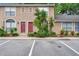 Charming townhome featuring dual front doors, well-maintained landscaping, and designated parking spaces at 1523 Casa Park Cir, Winter Springs, FL 32708