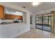 Functional kitchen with a breakfast bar and sliding glass doors to the lanai, great for casual dining at 1523 Casa Park Cir, Winter Springs, FL 32708