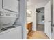 Laundry room features a stackable washer and dryer next to the bathroom at 1523 Casa Park Cir, Winter Springs, FL 32708