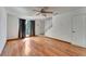Open living room featuring wood floors, a ceiling fan, and a staircase at 1523 Casa Park Cir, Winter Springs, FL 32708
