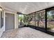 Enclosed patio with tiled floor and screened windows, offering a cozy outdoor living space at 1523 Casa Park Cir, Winter Springs, FL 32708