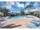 Community pool area including the hot tub and lounge chairs at 1523 Casa Park Cir, Winter Springs, FL 32708