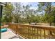 Balcony overlooking a lush green landscape with mature trees and clear skies at 1526 Maytown Rd, Oak Hill, FL 32759