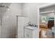 Updated bathroom with white marble tile shower and vanity with marble countertop at 1526 Maytown Rd, Oak Hill, FL 32759