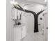 Bathroom with a decorative tree mural on the wall, granite countertops, and modern fixtures at 1526 Maytown Rd, Oak Hill, FL 32759