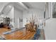 Bright foyer showcasing hardwood floors, a unique rustic railing, and access to multiple rooms at 1526 Maytown Rd, Oak Hill, FL 32759