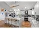 Beautiful kitchen features white cabinets, stainless steel appliances, a large island, and pendant lighting at 1526 Maytown Rd, Oak Hill, FL 32759