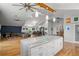 Bright and open kitchen with a large island, stainless steel appliances, and seamless flow to living areas at 1526 Maytown Rd, Oak Hill, FL 32759