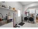 Bright laundry room with modern washer/dryer, sink, and ample storage space at 1526 Maytown Rd, Oak Hill, FL 32759