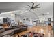 Open-concept living space featuring hardwood floors, neutral colors, and vaulted ceilings at 1526 Maytown Rd, Oak Hill, FL 32759