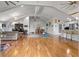 Spacious open-concept living area with high ceilings, hardwood floors, and a seamless flow to the kitchen at 1526 Maytown Rd, Oak Hill, FL 32759