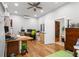 Office with desk space, hardwood floors, and a spiral staircase in the background at 1526 Maytown Rd, Oak Hill, FL 32759