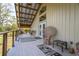 Welcoming porch with wicker furniture, perfect for relaxing outdoors at 1526 Maytown Rd, Oak Hill, FL 32759