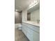 Modern bathroom features a large vanity, modern fixtures, and a tiled shower-tub combination at 1904 Diamond Head Cir, Lake Hamilton, FL 33851