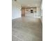 Open-concept living area showcasing the bright kitchen with island, tile flooring, and ample natural light at 1904 Diamond Head Cir, Lake Hamilton, FL 33851