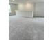 Spacious loft area with neutral carpet, bright natural light, and great for additional living space at 1904 Diamond Head Cir, Lake Hamilton, FL 33851