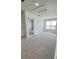 Bright and airy bedroom featuring plush carpeting and ample natural light at 1908 Diamond Head Cir, Lake Hamilton, FL 33851