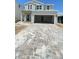 Charming two-story home with a modern design, spacious driveway, and neutral color palette at 1908 Diamond Head Cir, Lake Hamilton, FL 33851