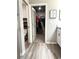 Bathroom featuring open doorway to walk-in closet, toilet room, and vanity at 2000 Golden Beak Dr, Eagle Lake, FL 33839