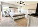 Primary bedroom suite with neutral decor, ceiling fan, and great natural light at 2000 Golden Beak Dr, Eagle Lake, FL 33839