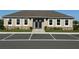 Exterior of community clubhouse with ample parking at 2000 Golden Beak Dr, Eagle Lake, FL 33839