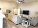 Spacious living room featuring vaulted ceilings, neutral decor, and wood-look floors at 2000 Golden Beak Dr, Eagle Lake, FL 33839