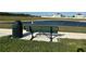 Park bench overlooking a calm lake at 2000 Golden Beak Dr, Eagle Lake, FL 33839