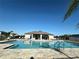 Community pool with lounge chairs at 2000 Golden Beak Dr, Eagle Lake, FL 33839
