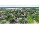 Community overview with manicured green space, showcasing the inviting pool and nearby lake at 2808 Revere Ct, Casselberry, FL 32707