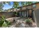 Backyard featuring brick patio, new fence, and landscaping around the townhome at 2808 Revere Ct, Casselberry, FL 32707