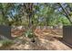 Backyard featuring new fence, greenery and landscaping around the townhome at 2808 Revere Ct, Casselberry, FL 32707