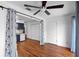Open concept living/bedroom with hardwood floors and kitchen view at 2808 Revere Ct, Casselberry, FL 32707