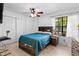 Cozy bedroom with natural light, built-in wardrobe, and a contemporary ceiling fan at 2808 Revere Ct, Casselberry, FL 32707
