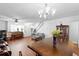 Open-concept dining room with hardwood floors and abundant natural light at 2808 Revere Ct, Casselberry, FL 32707
