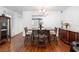Dining room with hardwood floors, elegant light fixture, and decorative furnishings at 2808 Revere Ct, Casselberry, FL 32707