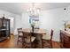 Dining room features hardwood floors, contemporary light fixture, and stylish decor at 2808 Revere Ct, Casselberry, FL 32707