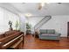 Inviting living room featuring hardwood floors and staircase at 2808 Revere Ct, Casselberry, FL 32707