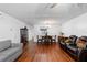 Open-concept living room and dining area with hardwood floors and abundant natural light at 2808 Revere Ct, Casselberry, FL 32707