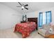 Bedroom features neutral floors, wooden furniture, closet and blue curtains at 2808 Revere Ct, Casselberry, FL 32707