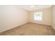 Bright bedroom featuring a ceiling fan and a window offering plenty of natural light at 2924 Jebidiah Loop, St Cloud, FL 34772
