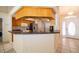 Kitchen with a breakfast bar, wood cabinets, dark countertops, stainless steel appliances and an open floor plan at 2924 Jebidiah Loop, St Cloud, FL 34772