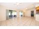Bright living room with tiled flooring and sliding glass doors leading to the lanai at 2924 Jebidiah Loop, St Cloud, FL 34772