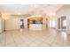 Bright and open living area with tile flooring, high ceilings, and seamless access to the kitchen at 2924 Jebidiah Loop, St Cloud, FL 34772