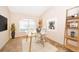 Bright office space featuring a modern glass desk and natural light from a large window at 2924 Jebidiah Loop, St Cloud, FL 34772