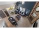 Top-down view of a bright living room with comfortable seating, fireplace, and many windows at 3001 Little Cypress Cv, Winter Park, FL 32792