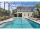 Screened backyard pool and patio area, perfect for outdoor relaxation and entertaining at 3001 Little Cypress Cv, Winter Park, FL 32792