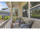 Cozy porch showcasing comfortable seating, ideal for relaxation and enjoying the outdoor views at 3001 Little Cypress Cv, Winter Park, FL 32792