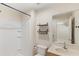 Bathroom features shower stall, toilet, vanity with sink, large mirror and wall storage at 3064 Yellow Lantana Ln, Kissimmee, FL 34747