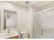 Bathroom features walk-in shower, toilet, vanity with sink, and large mirror at 3064 Yellow Lantana Ln, Kissimmee, FL 34747