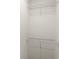 A white painted closet featuring two wire racks for convenient storage at 3064 Yellow Lantana Ln, Kissimmee, FL 34747